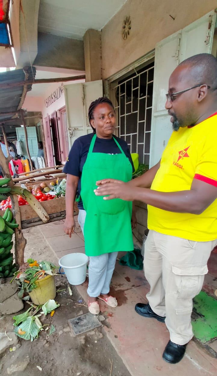 A field visit with a vegetable vendor outside her shop, in MAGGI branded wear